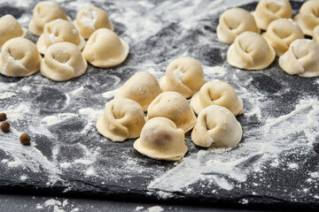 Handmade Ukrainian meat dumplings, ready for cooking, traditional varenyky with meat filling
