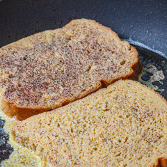 Cooking french toast in a pan on butter
