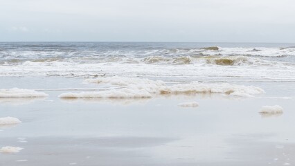 Tranquil Coastal Scene White Sea Foam and Waves on Crystal Clear Beach