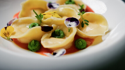 Colorful Cappelletti Pasta With Tomato Cream And Flowers 