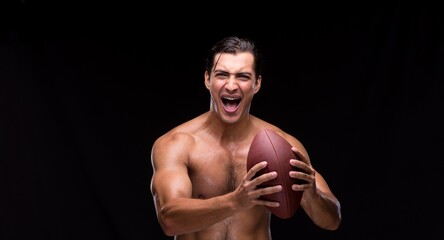 Obraz premium Ripped muscular man with american football