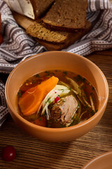 Hearty Beef and Vegetable Shurpa Soup with Fresh Ingredients and Rustic Bread
