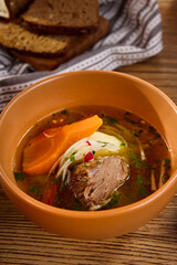 Delicious Beef Shurpa Soup with Vegetables in a Rustic Setting
