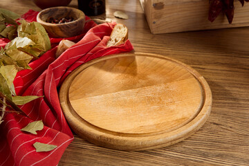 Wooden Cutting Board with Bread and Ingredients on Rustic Wooden Table