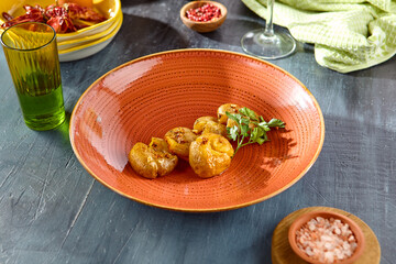 Crispy Baked Baby Potatoes with Salt and Pepper on Rustic Plate