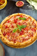 Delicious Tomato and Bacon Pizza with Fresh Basil Topping