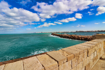 View of the azure blue and green shades of the Mediterranean sea and Alexandria city skyline from...