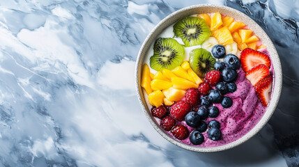 Fresh and Colorful Fruit Smoothie Bowl on Marble Background