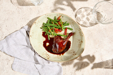 Duck Leg Confit with Berry Sauce and Green Bean Garnish - Gourmet Fine Dining Cuisine
