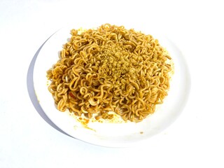 A plate of fried instant ramen noodle or Indonesian Mie Goreng isolated on white background