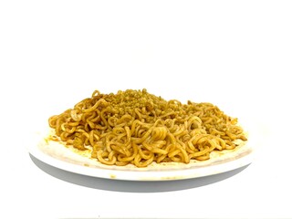 A plate of fried instant ramen noodle or Indonesian Mie Goreng isolated on white background