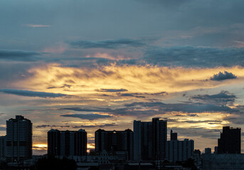 Silhouette view of Modern high-rise buildings and background of Dramatic sky in the city of Bangkok. Picturesque view of skyscrapers before Sunset. use it as your Wallpaper, Poster and Space for text,