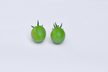 Green tomatoes on isolated white background