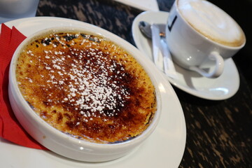 French dessert: crème brûlée and cappuccino in Paris, France