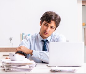 Man under stress measuring his blood pressure