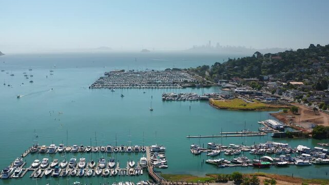 Aerial view of Sausalito marina and San Francisco city skyline on a hazy day