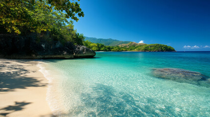 A serene seaside view with crystal clear water and a white sandy beach