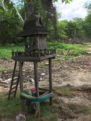A spirit house (Ssan Phra Phum) is a small shrine typically found in several places in Thailand. It's constructed to house protective spirits or ancestors believed to safeguard the residents in area.