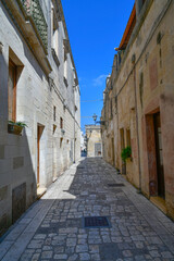 Fototapeta premium A street in the historic center of Martano, a tourist town in Puglia in Italy.