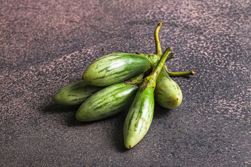 Small organic young green eggplant