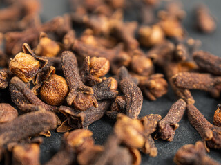 A close-up of aromatic cloves, highlighting the texture and rich color