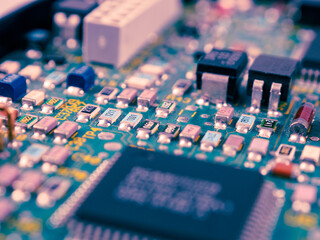 Close-up of microcircuits and components: chips, diodes and capacitors on a printed circuit board, revealing the world of electronics