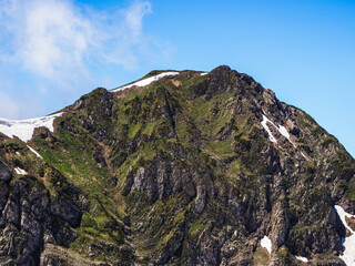 Snow-capped mountain peaks glistening in the sun create a magnificent backdrop for spectacular nature all year round