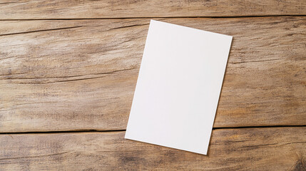 A greeting card mockup placed on a rustic wooden table.