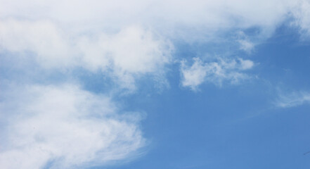 Bright blue sky with clouds