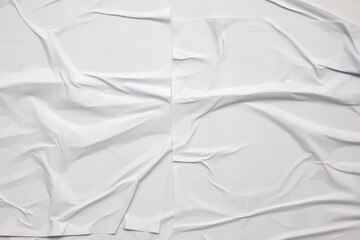 Obraz premium white crumpled and creased glued wrinkled paper poster texture background