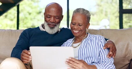 Laptop, video call and senior black couple on a sofa waving for greeting in the living room at home. Technology, online and elderly man and woman in retirement on virtual conversation with computer. - Powered by Adobe