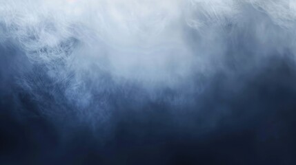 Obraz premium A thick fog rolls over a mountain ridge, obscuring the view. The clouds above are dark and heavy, suggesting an impending storm. The air is still and the silence is broken only by the sound of the win