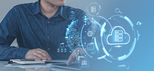 Man working in laptop, cloud service hologram and data backup