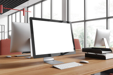 Fototapeta premium Office coworking interior with pc computer mockup display on table
