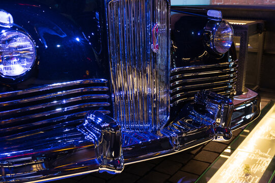 Moscow, Russia - 13 November, 2022: emblem of soviet old ZIS-110 car on the sparkling car radiator grille on VDNKh. Vintage Soviet USSR car of Special Purpose Garage.