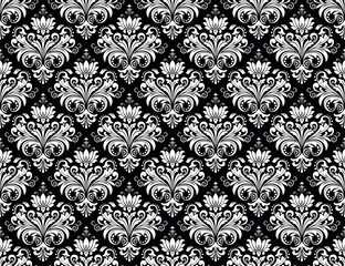 Floral pattern. Vintage wallpaper in the Baroque style. Seamless vector background. White and black ornament for fabric, wallpaper, packaging. Ornate Damask flower ornament.