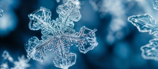 Closeup of a unique snowflake on a vibrant blue background