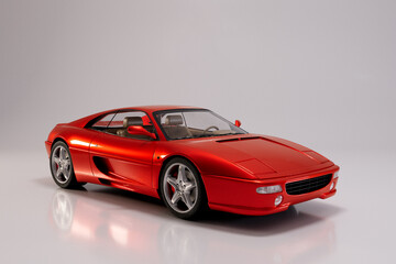 Orange sport car on white background, high quality 3D image.