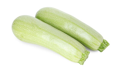 Two fresh ripe zucchinis isolated on white, top view