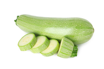 Fresh whole and cut zucchinis isolated on white, top view