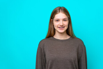 Fototapeta premium Teenager Russian girl isolated on blue background