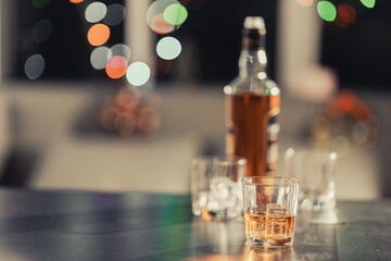 Businessmen discussing work and drinking Vikis in a dark room, close-up photo