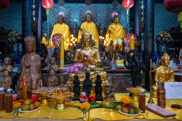 Chachoengsao, Thailand, June 04, 2024, Wat Chin Pracha Samoson, Buddhist Temple Altar with Golden Statues and Offerings.