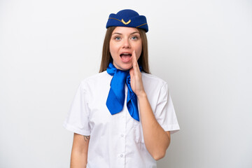 Airplane Lithuanian woman stewardess isolated on white background with surprise and shocked facial expression