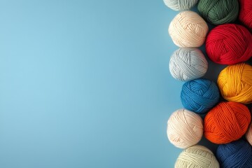 Colorful Yarn Balls on Solid Blue Background