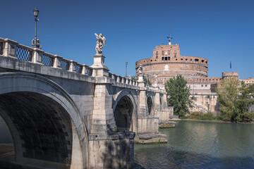 Castel Sant Angelo ancient castle and bridge over Tiber river on sunny day, Rome, Italy