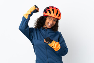 Teenager cyclist woman isolated on white background celebrating a victory