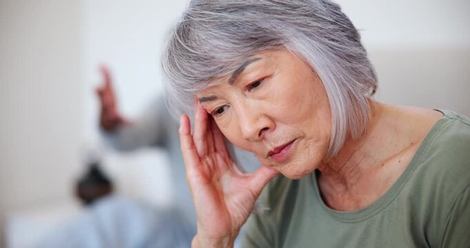 Frustrated senior couple, headache and divorce in argument, disagreement or fight on living room sofa at home. Mature woman ignore man for cheating affair, breakup or dispute in toxic relationship