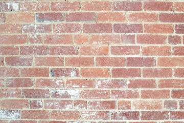 Textured red brick wall with white wash