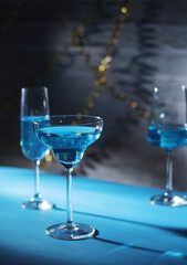 Glasses with blue alcohol cocktail ready for a party
